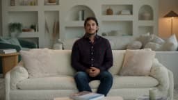 AI presenter Brent, sofa