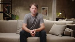 AI presenter Emanuel, sofa