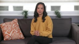 AI presenter Abigail, sofa